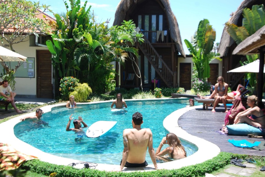 Guests practicing and relaxing in the pool at SurfWG